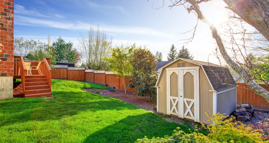 Fenced backyard with storage shed in Hammond